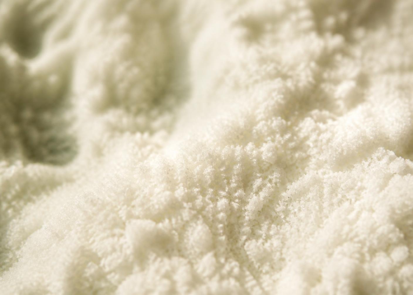 Abstract macro texture of fine white crystalline powder